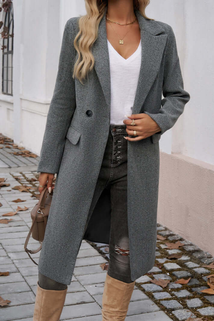 Stylish women's long double-breasted coat, a sophisticated outerwear piece for fall.