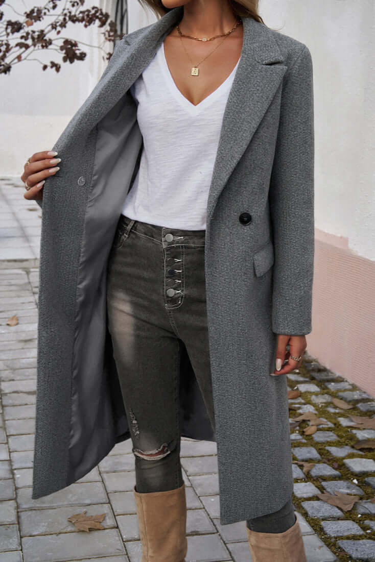 Sophisticated women's double-breasted long coat, ideal formal or casual outerwear for women.