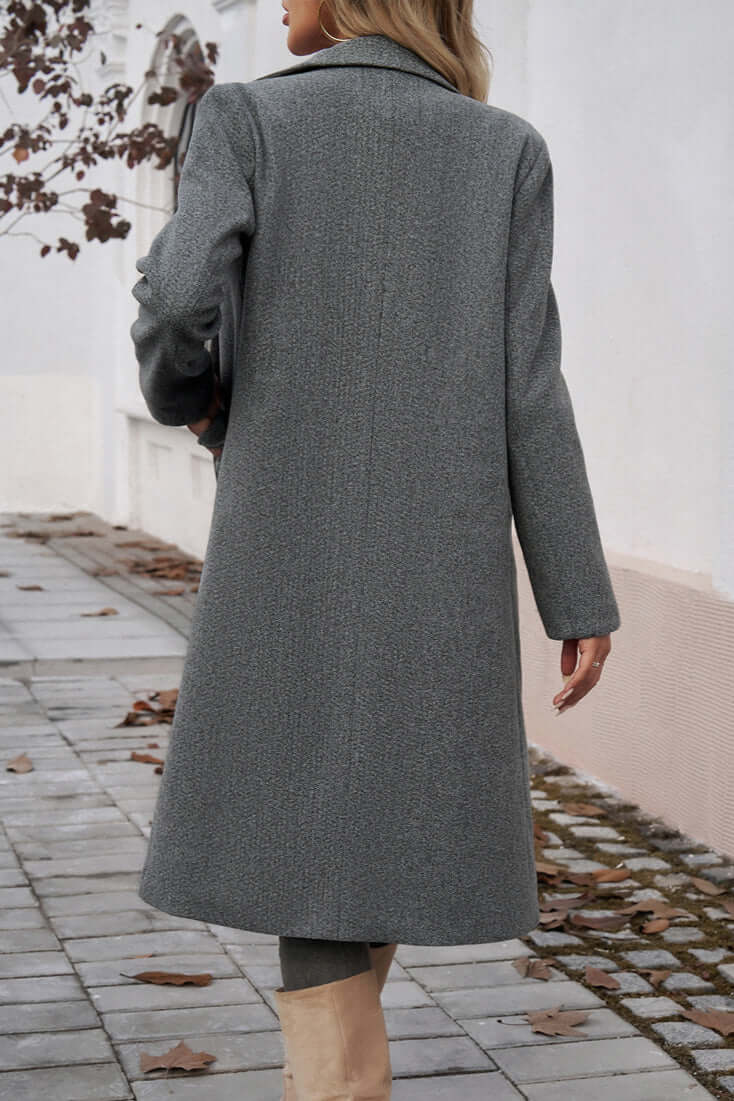 Stylish women's long coat, double-breasted, providing elegant warmth for cold weather.