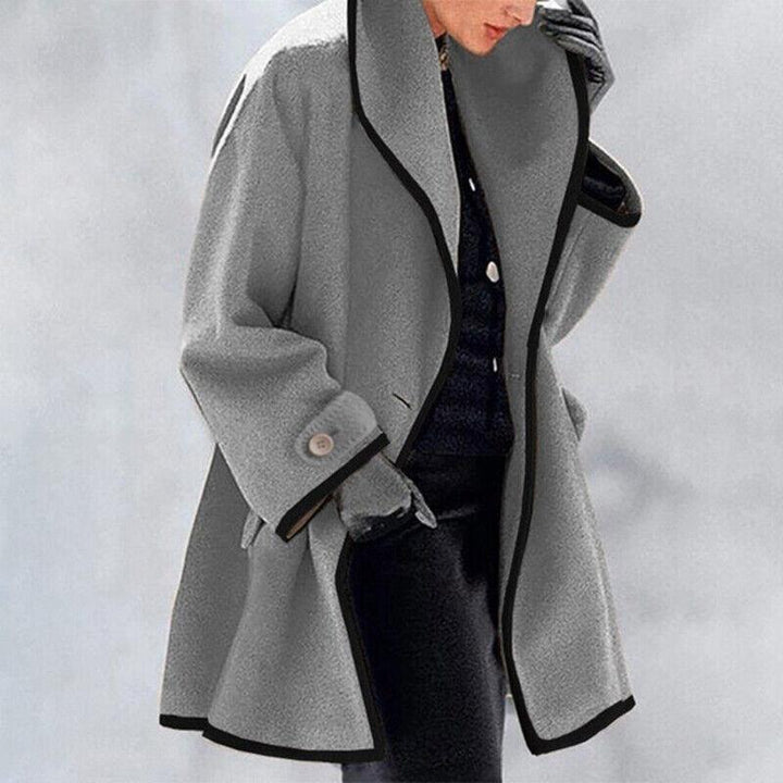 Fashionable women's double-breasted trench coat, a long winter jacket for stylish ladies' outerwear.