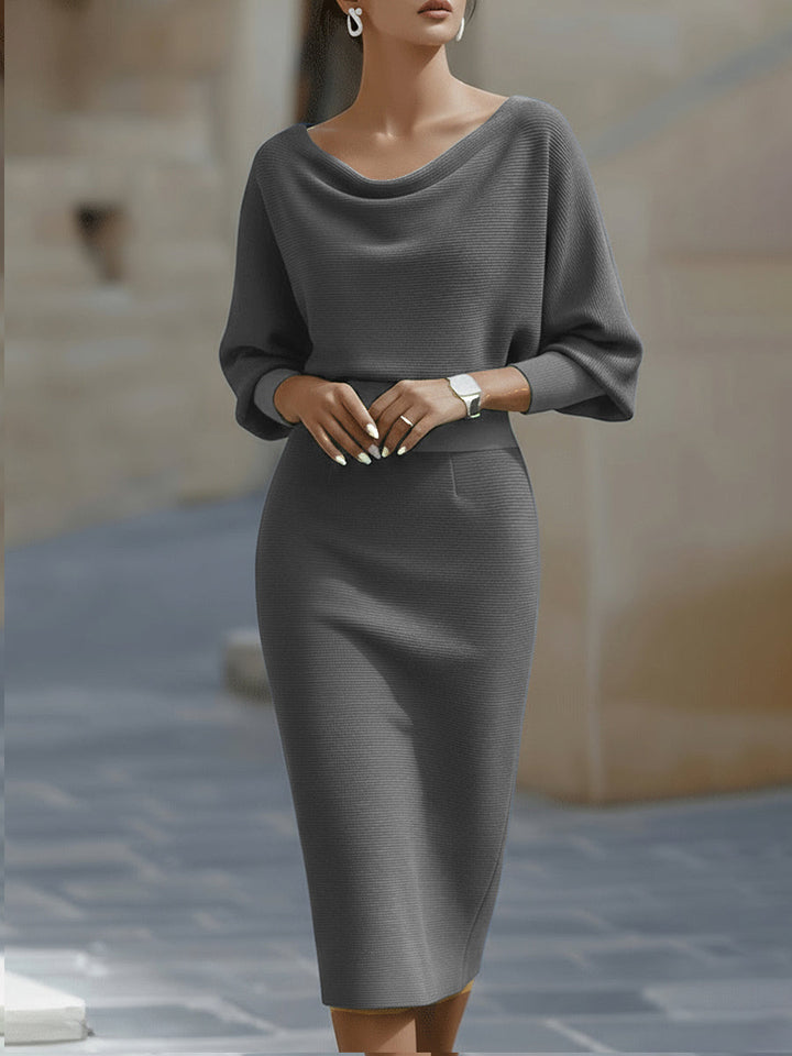 Sophisticated women's evening dress, featuring a draped cowl neck and stylish batwing sleeves.