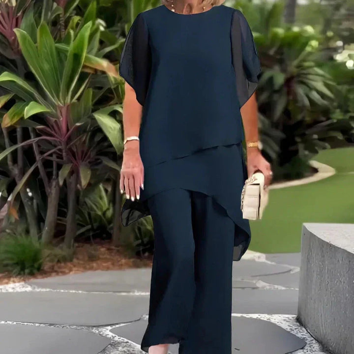 Comfortable women's two-piece set featuring draped palazzo pants and a stylish top.