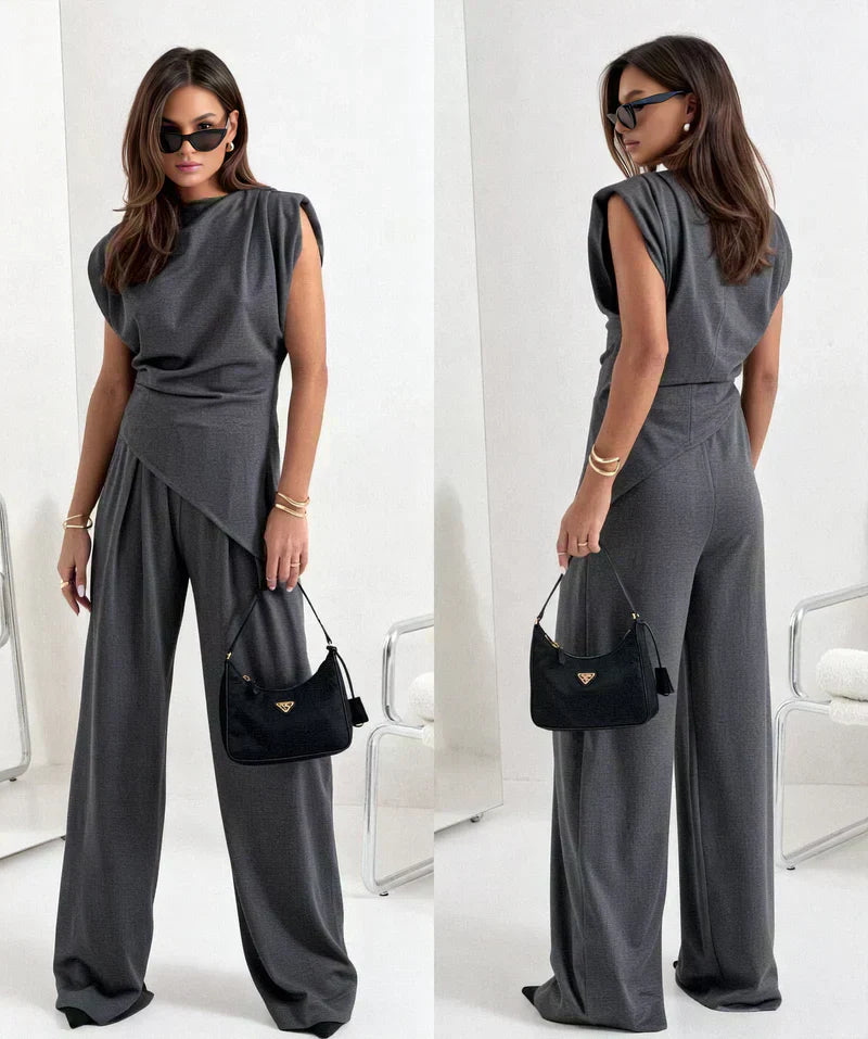 Stylish women's two-piece set: a draped top and flowy wide-leg trousers for an elegant casual look.