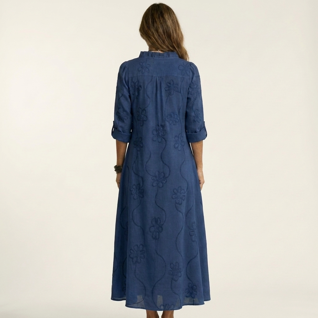 Chic women's floral embroidered maxi dress. Relaxed fit, ideal for summer comfort and vacation elegance.