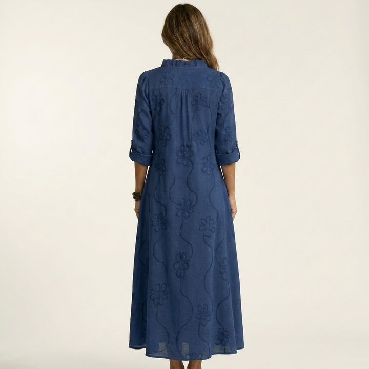 Chic women's floral embroidered maxi dress. Relaxed fit, ideal for summer comfort and vacation elegance.