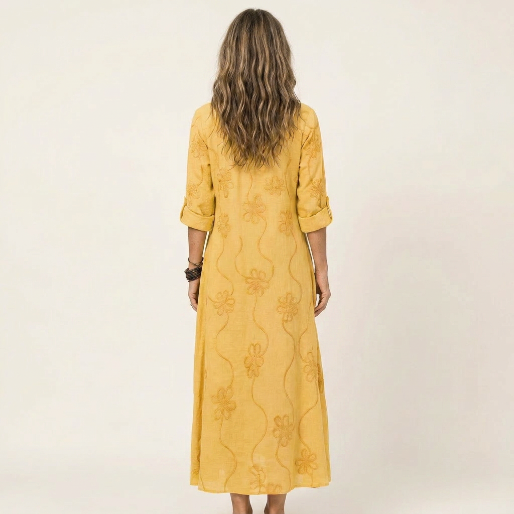 Embroidered maxi dress for women, offering elegant summer comfort. Relaxed fit, perfect for any vacation.