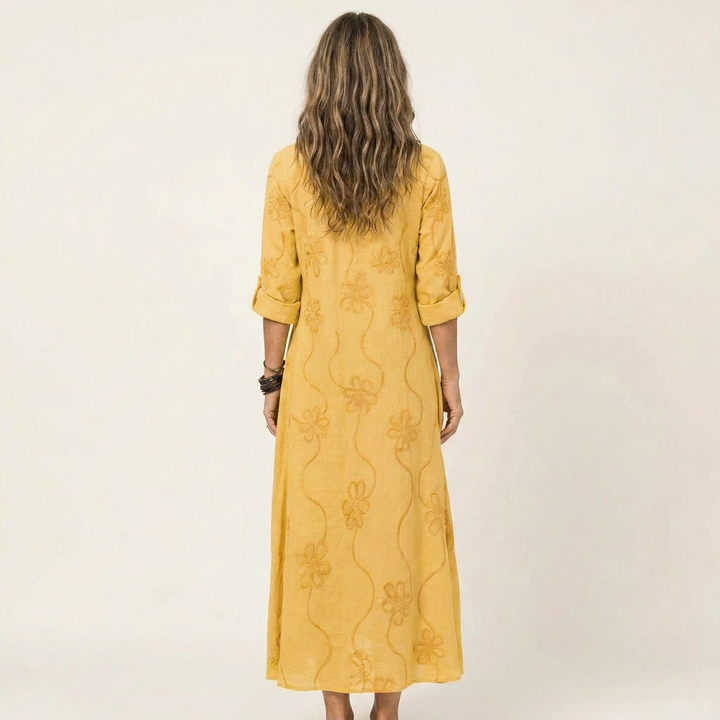 Embroidered maxi dress for women, offering elegant summer comfort. Relaxed fit, perfect for any vacation.