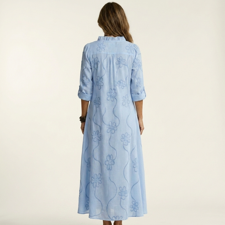 Elegant women's summer maxi dress featuring beautiful floral embroidery. Comfortable relaxed fit for resort.