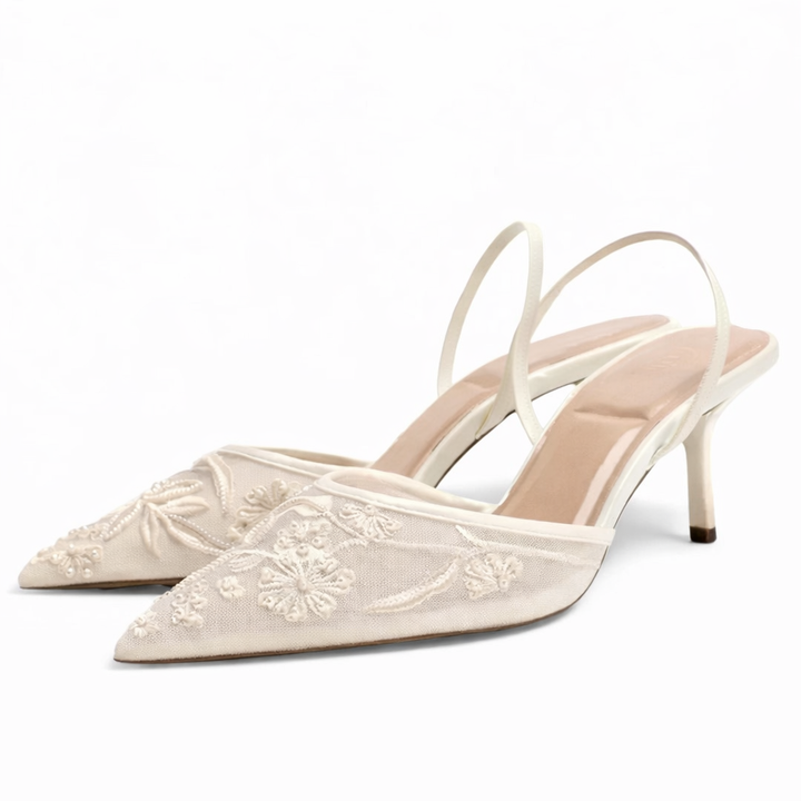 Formal women's pointed toe mule heels, featuring intricate floral embroidery and sheer mesh design, elegant evening wear.