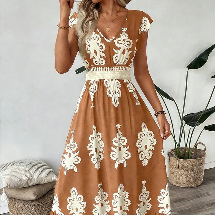 Elegant women's embroidered summer midi dress with V-neck and a flattering flared silhouette.