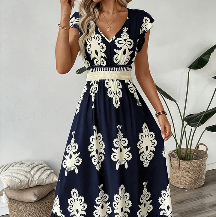 Must-have women's elegant embroidered V-neck summer dress, stylish and comfortable midi fashion.