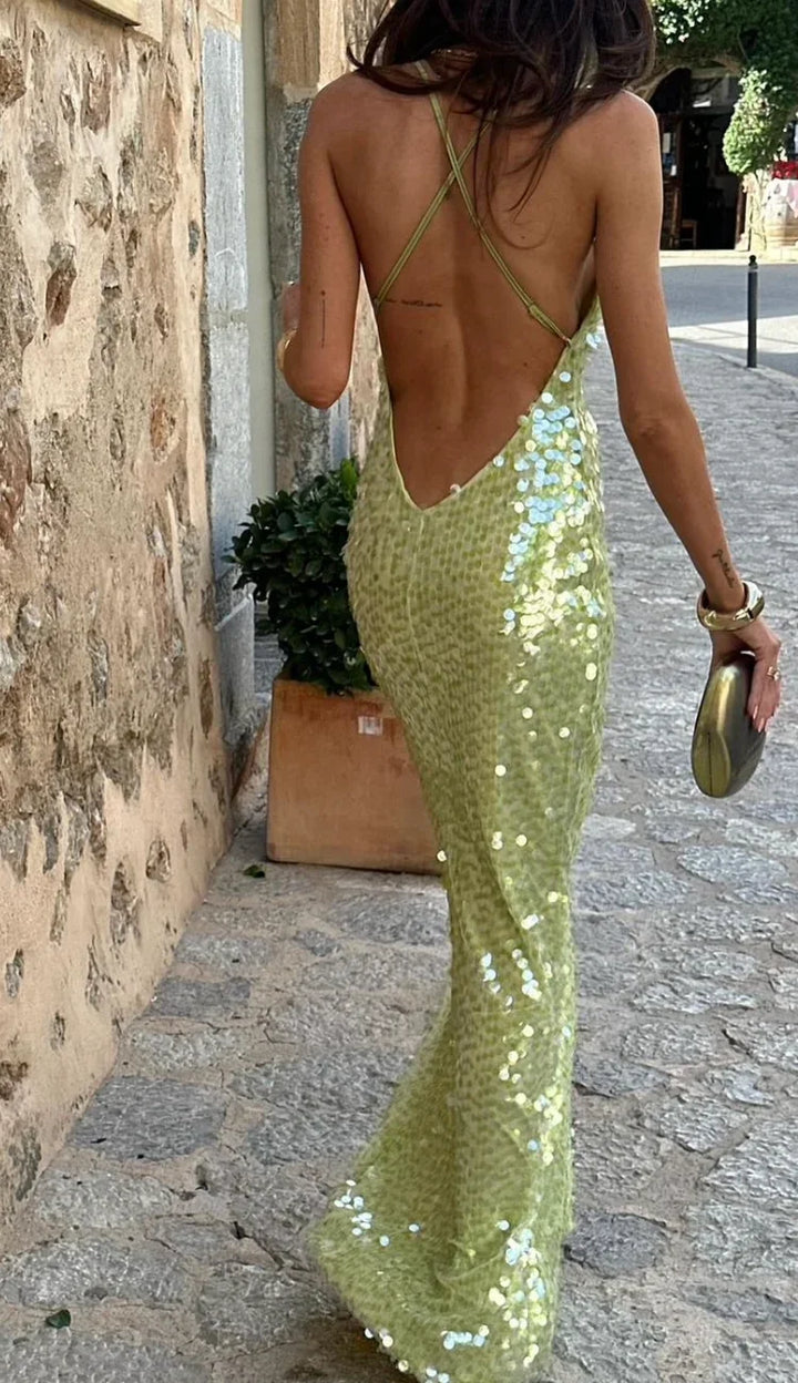 Shimmering green sequin backless maxi dress. Elegant formal wear, gala gown & wedding guest attire for women.