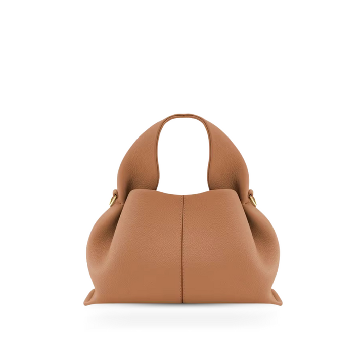 Women's elegant faux leather shoulder bag with secure magnetic closure, perfect for everyday style.