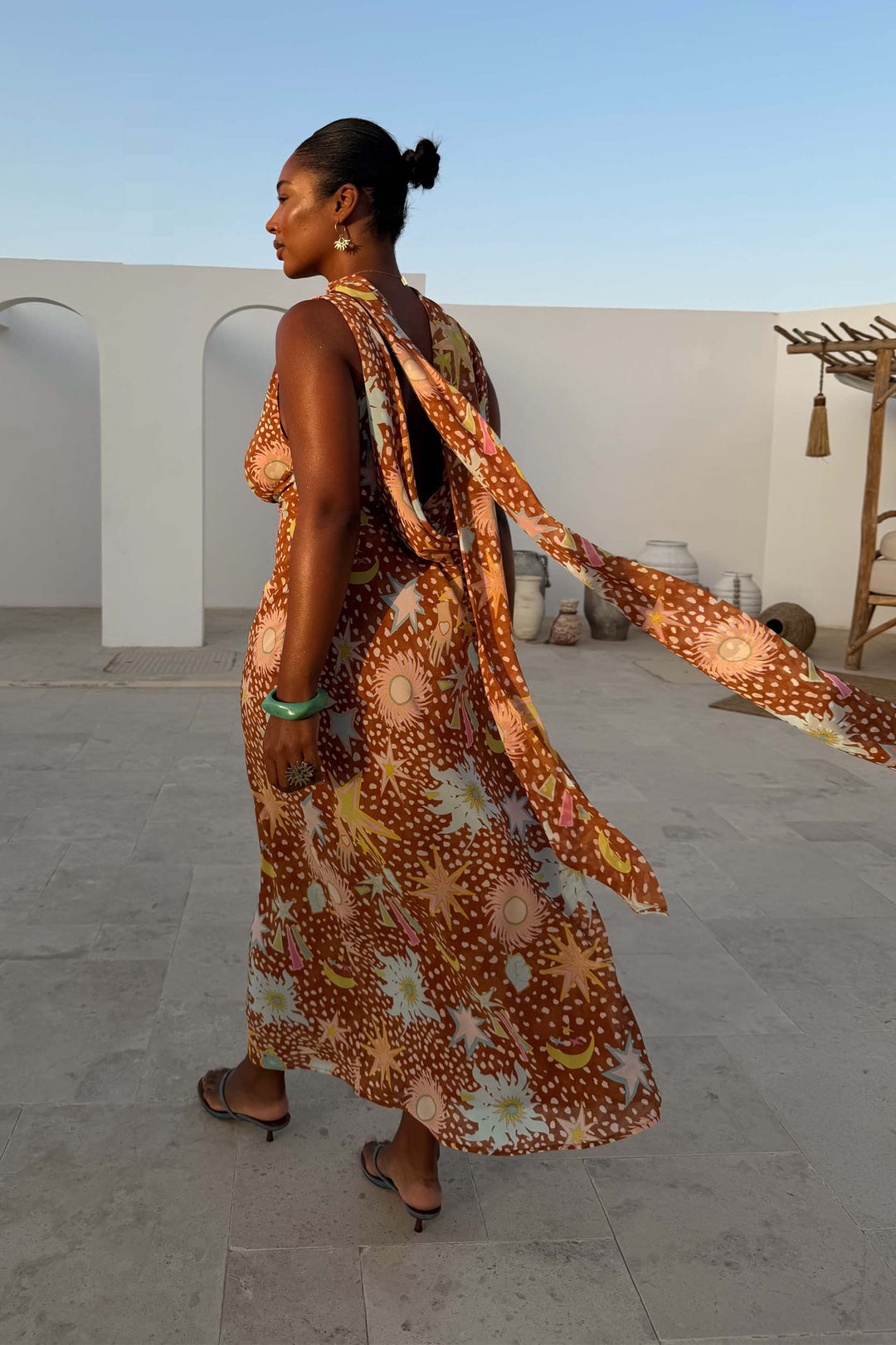 Close-up of the unique fawn print & elegant cowl neck on a women's halter maxi dress. Detachable scarf detail.