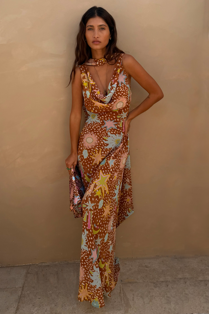 Flowy fawn print halter maxi dress with a sophisticated cowl neck. Ideal as a house dress or resort wear.