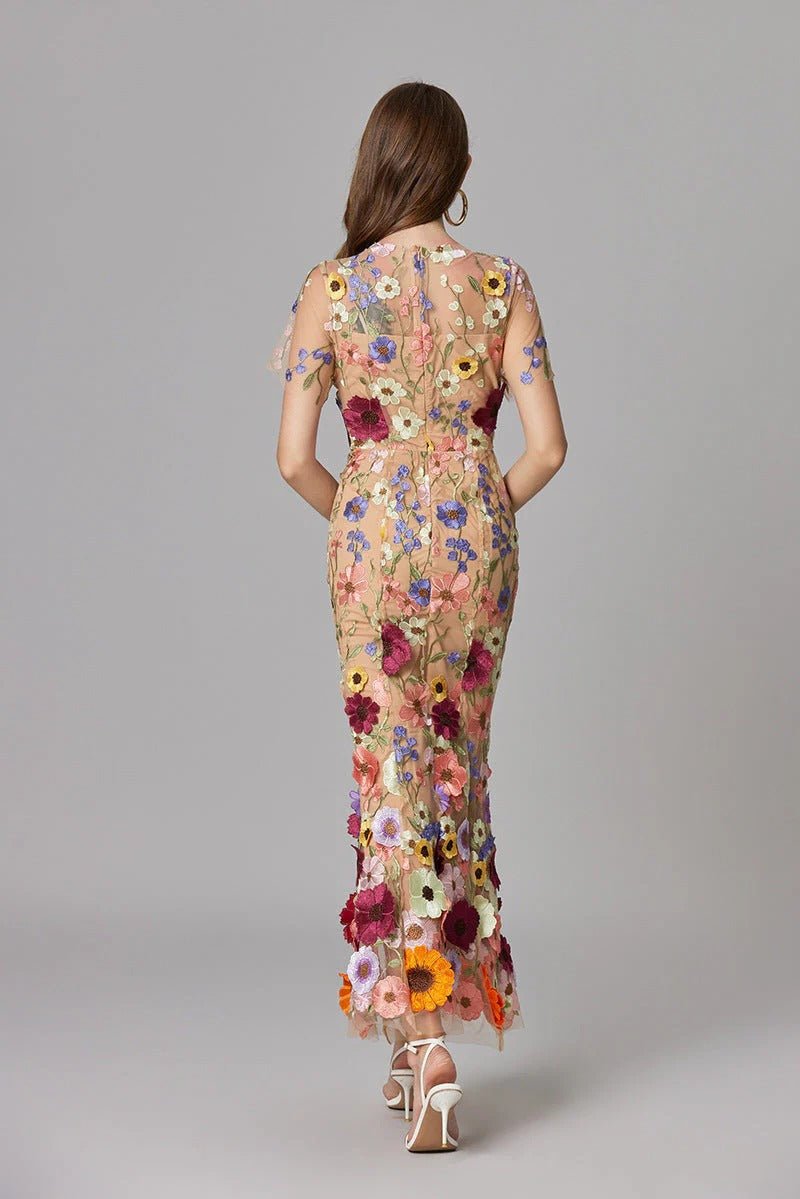Women's elegant floral applique sleeveless long dress, suitable for sophisticated gatherings.