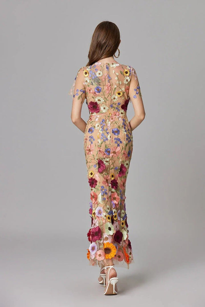Women's elegant floral applique sleeveless long dress, suitable for sophisticated gatherings.