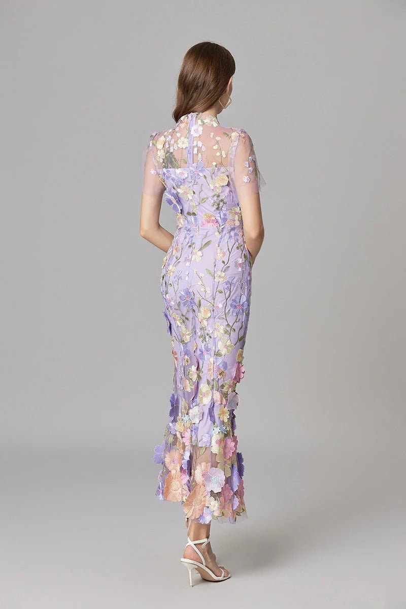 Sophisticated women's long maxi dress, with elegant floral applique and sleeveless cut.