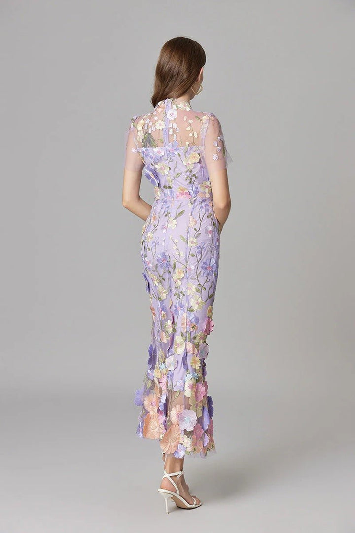 Sophisticated women's long maxi dress, with elegant floral applique and sleeveless cut.