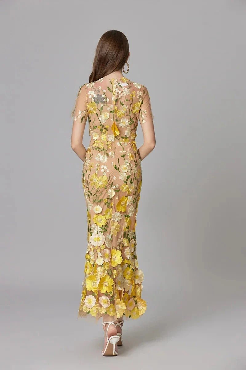 Women's elegant party maxi dress, featuring delicate floral applique & a sleeveless silhouette.