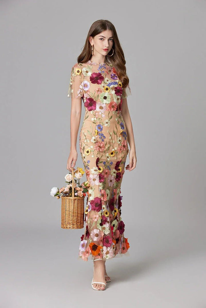 Elegant sleeveless maxi dress for women, featuring intricate floral applique details.