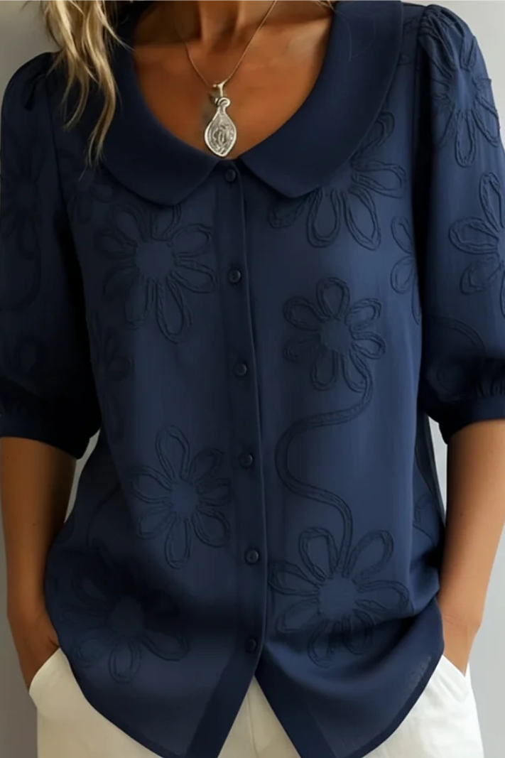 Relaxed fit women's floral blouse with timeless charm. An elegant round neck top ideal for summer casuals.