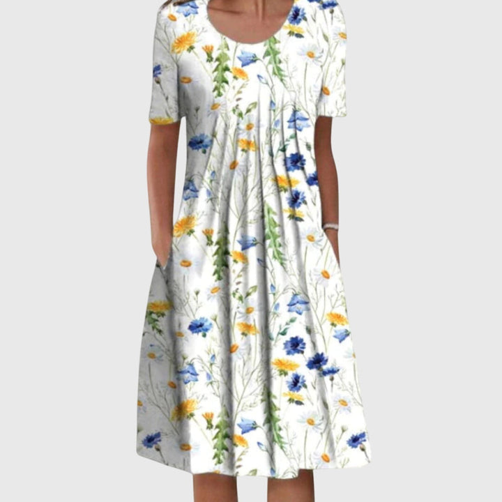 Flattering printed floral dress for women, with a chic round neck. Ideal for elegant summer events.