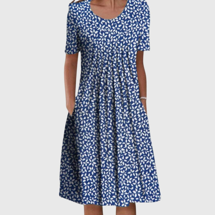 Versatile women's floral round neck dress, comfortable & elegant for casual or special summer occasions.