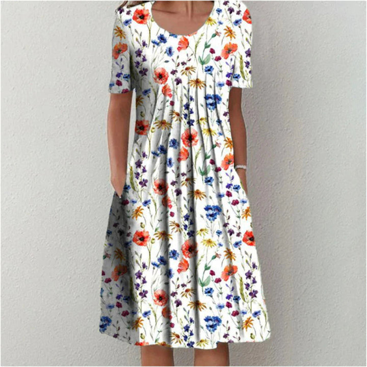 Women's elegant floral dress with pockets; comfortable A-line summer party wear.