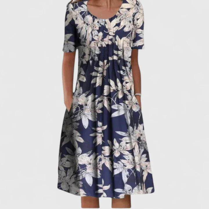 Summer floral party dress for women; elegant, comfortable, and features handy side pockets.