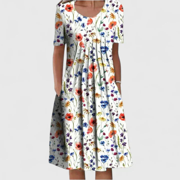 Women's versatile elegant floral dress with pockets; comfortable, chic, and ideal for summer occasions.