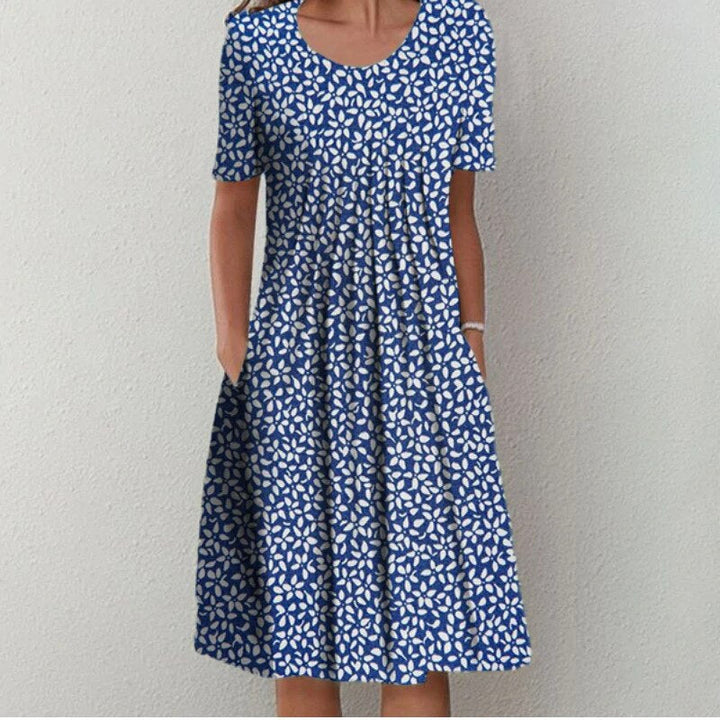 Chic women's floral dress, elegant design, comfortable fit, and practical pockets for any occasion.