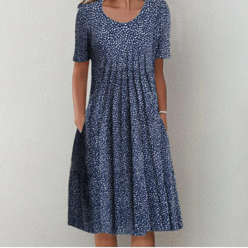 Women's elegant floral summer dress with pockets; versatile, comfortable, and party-ready.