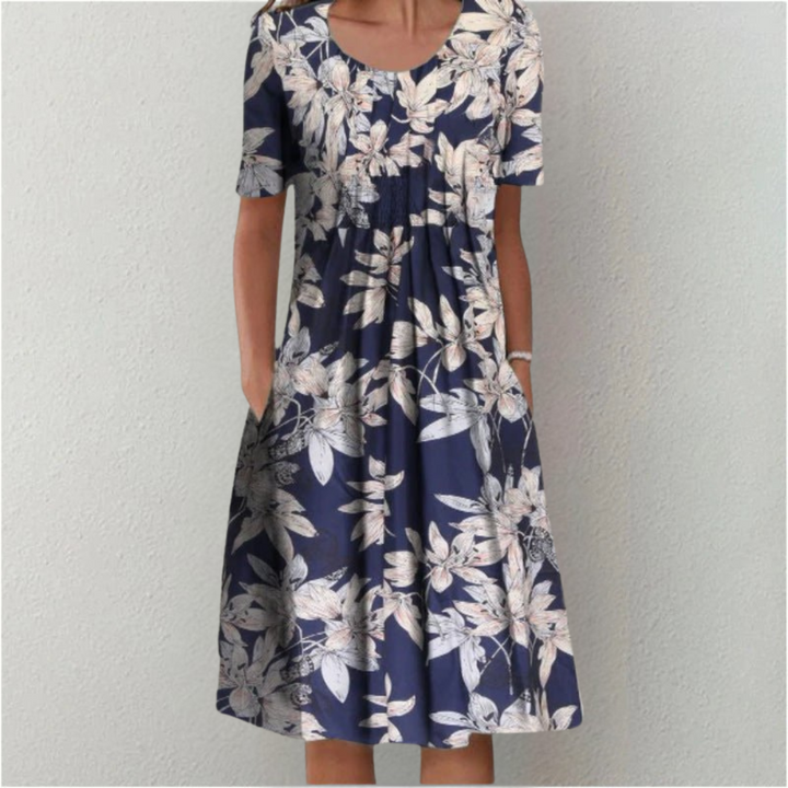 Elegant women's floral print dress, comfortable design, and convenient pockets for everyday chic.