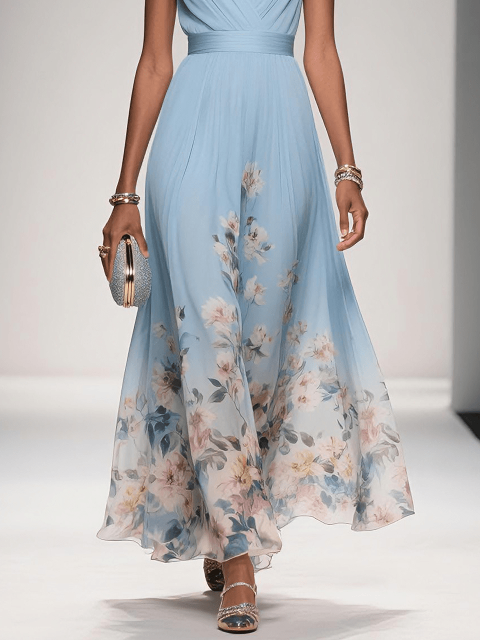 Posing in a beautiful floral drop waist maxi dress, a chic choice for any summer formal event.