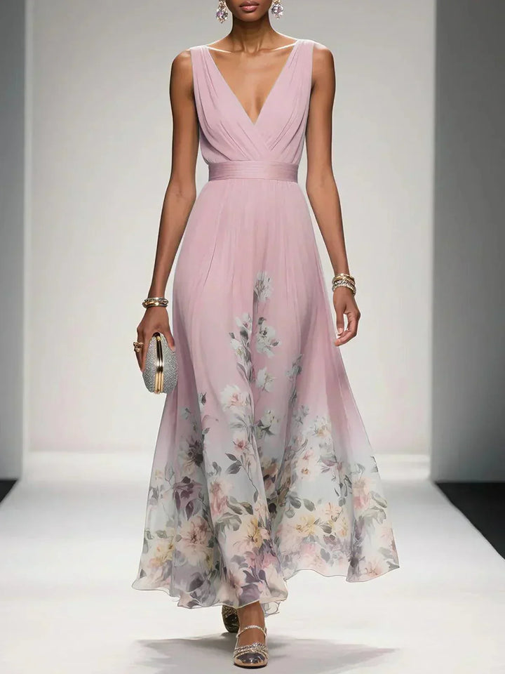 Flowing floral drop waist maxi dress, perfect summer wedding guest attire with an elegant silhouette.