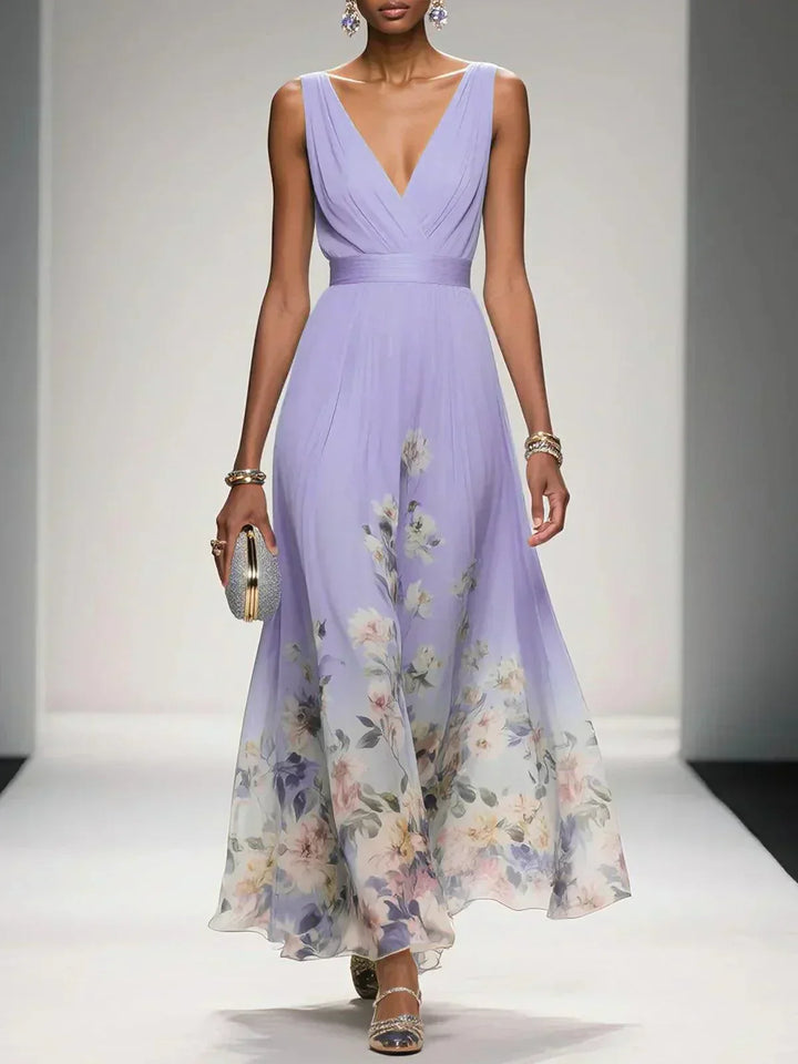 Vibrant floral print on lightweight fabric of a women's drop waist maxi summer dress.