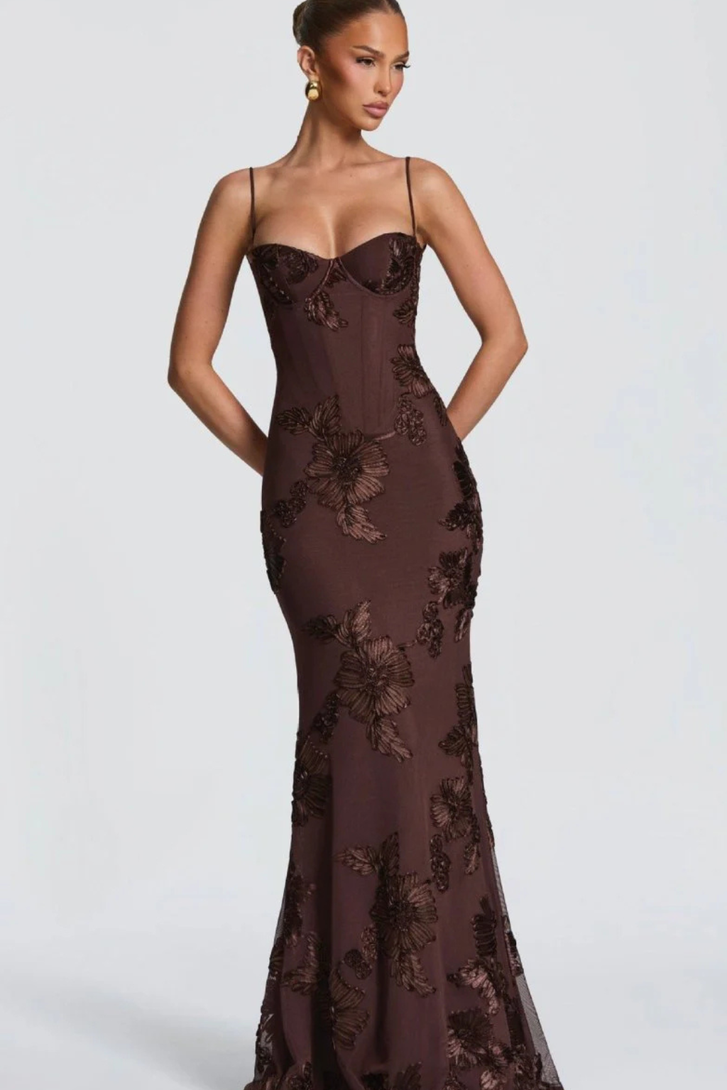 Back view of women's elegant floral embroidered long dress, suitable for special events.