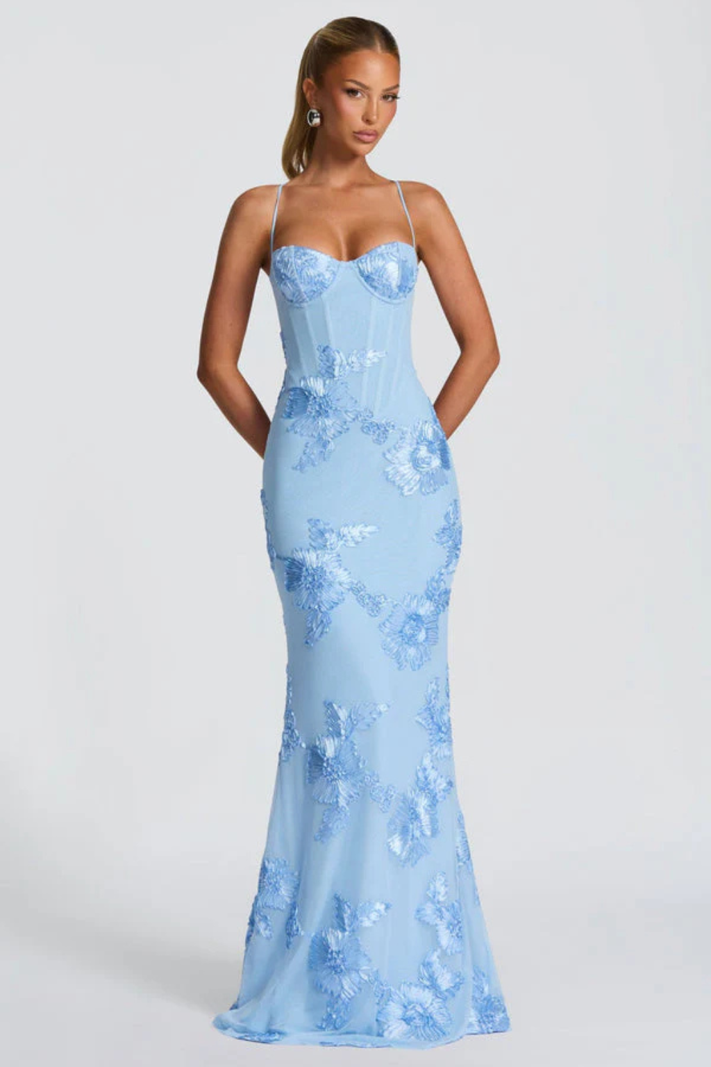 Full length shot of women wearing an elegant floral embroidered cami maxi dress.