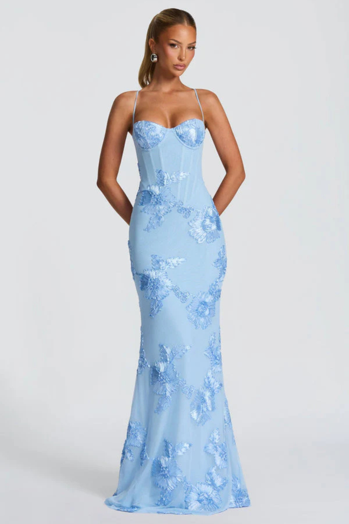 Full length shot of women wearing an elegant floral embroidered cami maxi dress.