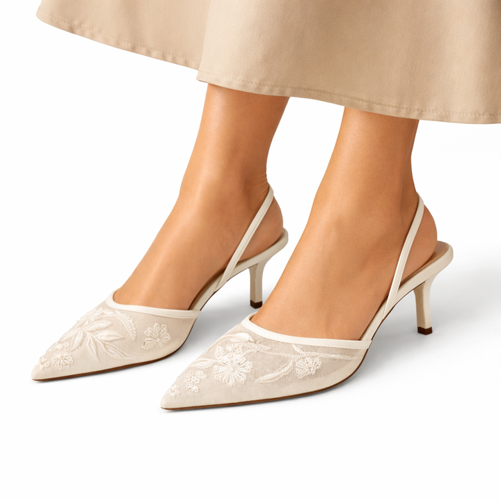 Women's elegant floral embroidered mule heels with a pointed toe, ideal for evening and formal events.