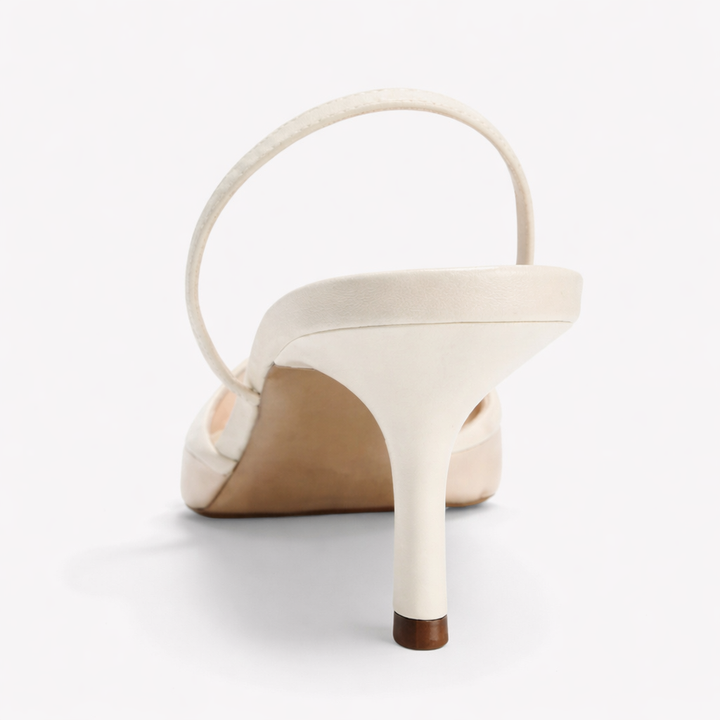 Sophisticated women's pointed-toe mule heels, showcasing exquisite floral embroidery, perfect for parties.
