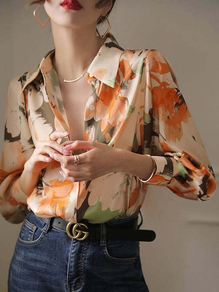 Smart casual women's blouse featuring a delicate floral ink print and a comfortable, elegant relaxed fit.