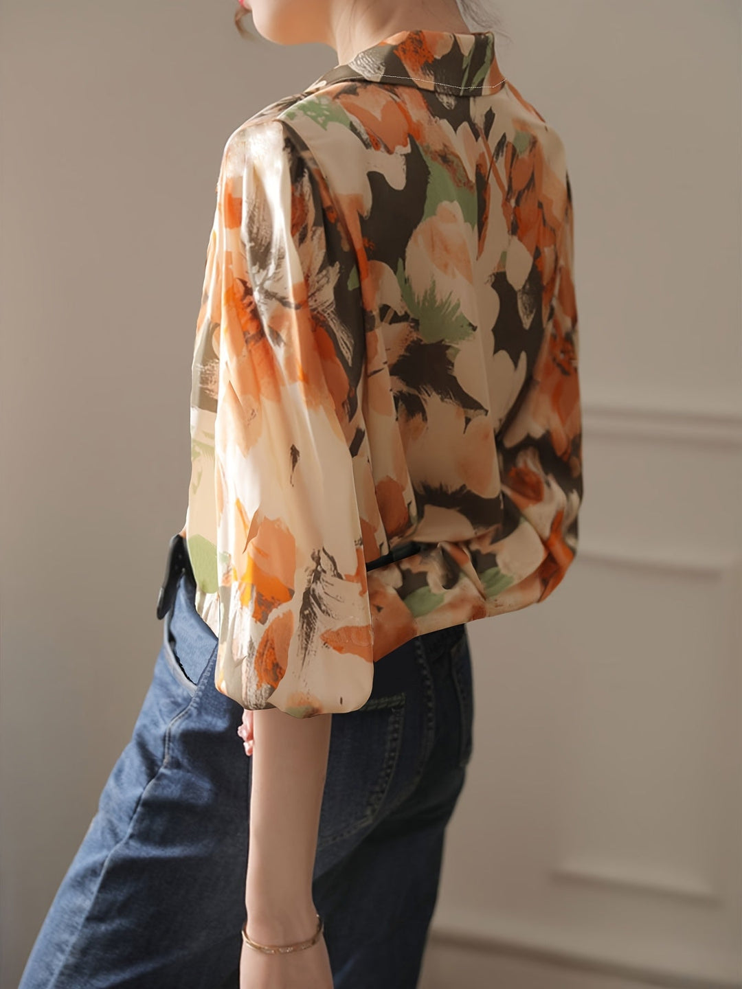 Stylish women's floral ink print blouse, offering an elegant relaxed fit for comfortable and versatile wear.