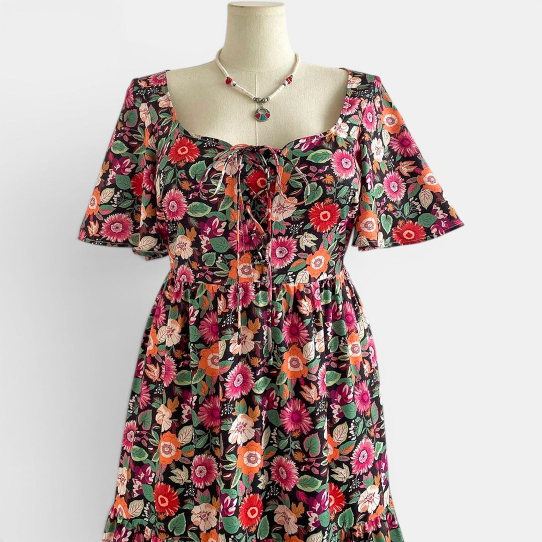 Women's elegant summer maxi dress with a delicate floral design, flowing and comfortable.
