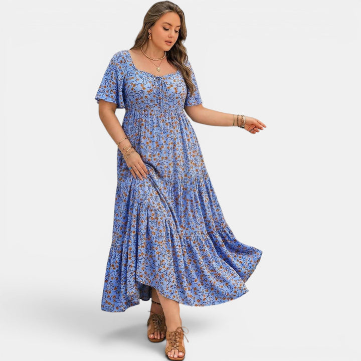 Elegant women's maxi dress with an A-line cut and beautiful floral print, ideal for summer.