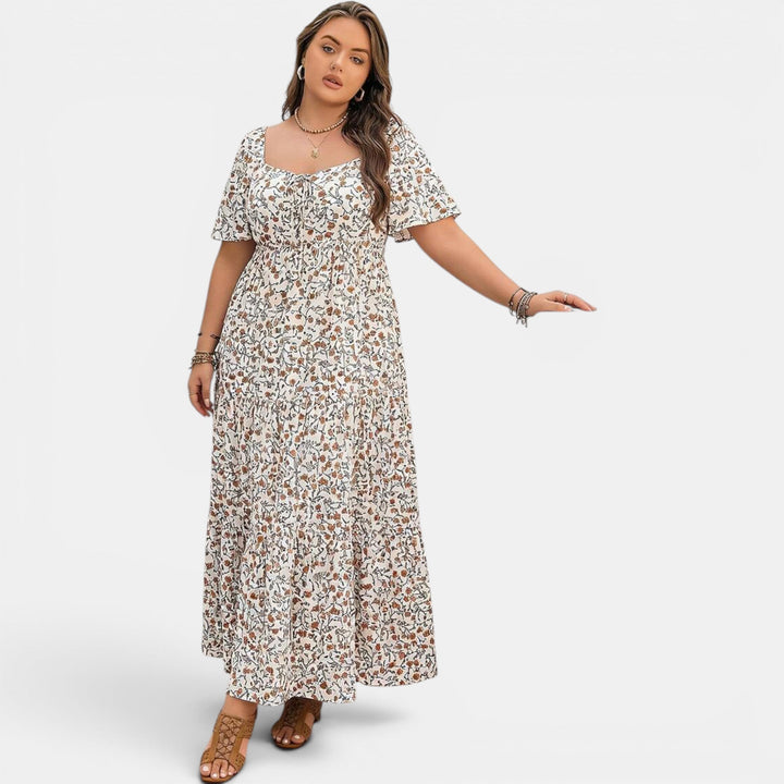 Women's elegant maxi dress featuring an all-over floral pattern, perfect for vacation.