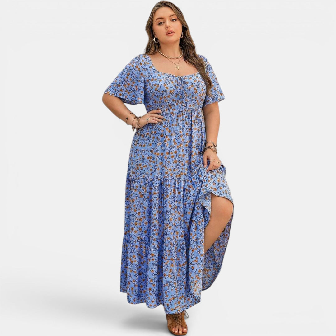 Flowing boho maxi dress for women, featuring a vibrant floral print, ideal for vacation.