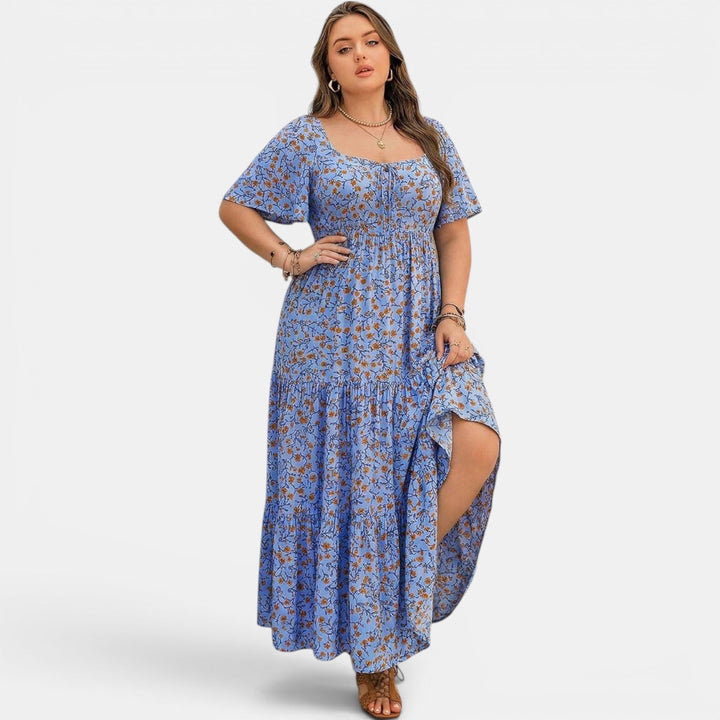Flowing boho maxi dress for women, featuring a vibrant floral print, ideal for vacation.