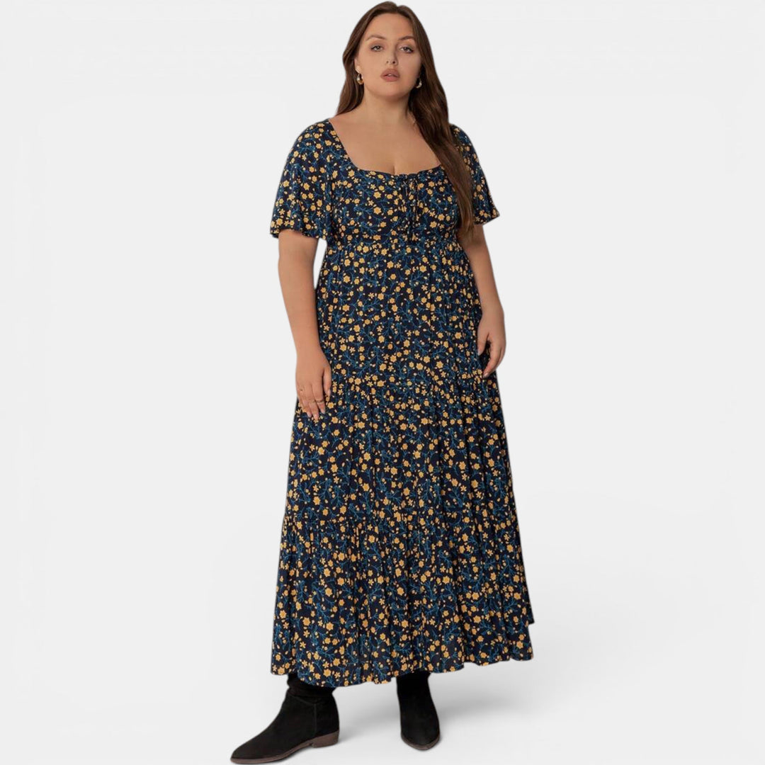 Graceful floral maxi dress for women, an elegant A-line summer design with a delicate print.